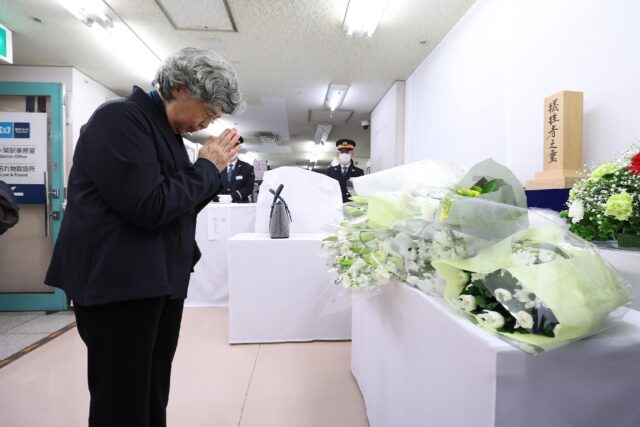 Shizue Takahashi pays her respects at the Tokyo subway where her husband and a dozen other