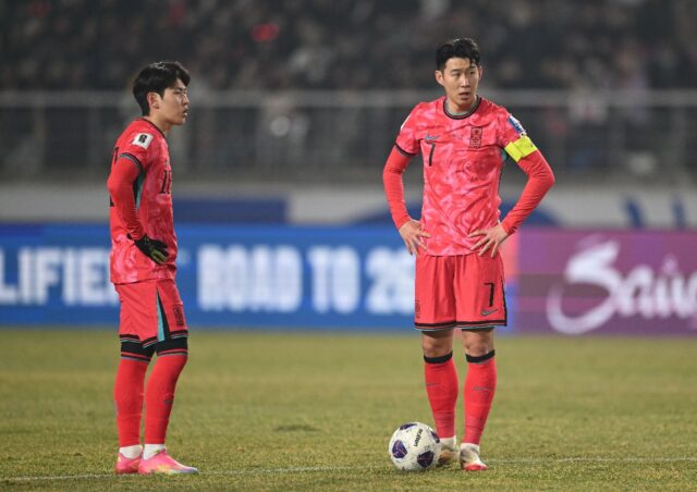 South Korea's Son Heung-min (R) and Lee Kang-in prepare a free-kick against Oman