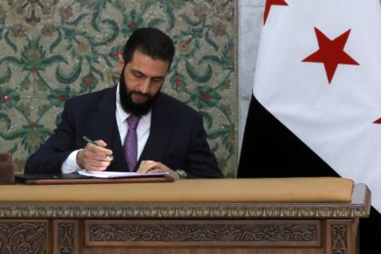 Syrian leader Ahmed al-Sharaa signs a new constitutional declaration, which will regulate