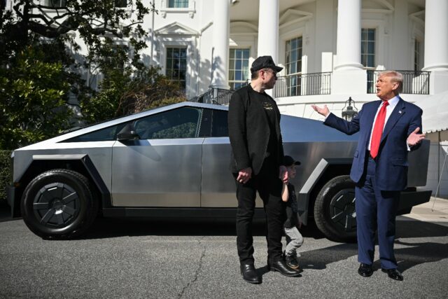 US President Donald Trump (R) with Tesla CEO Elon Musk (L) and a Cybertruck at the White H