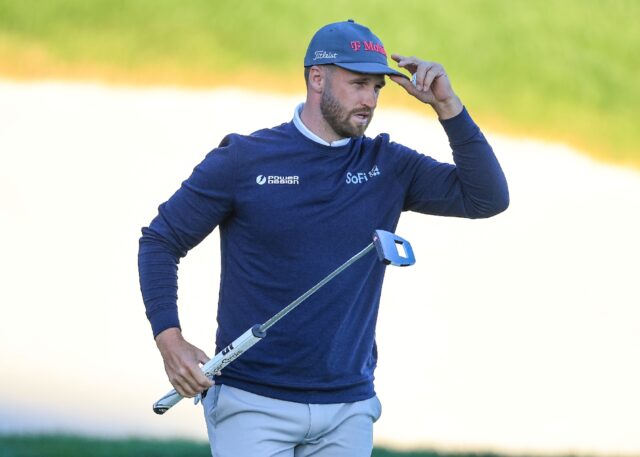 Wyndham Clark acknowledges the crowd after taking a two-shot lead at the Arnold Palmer Inv