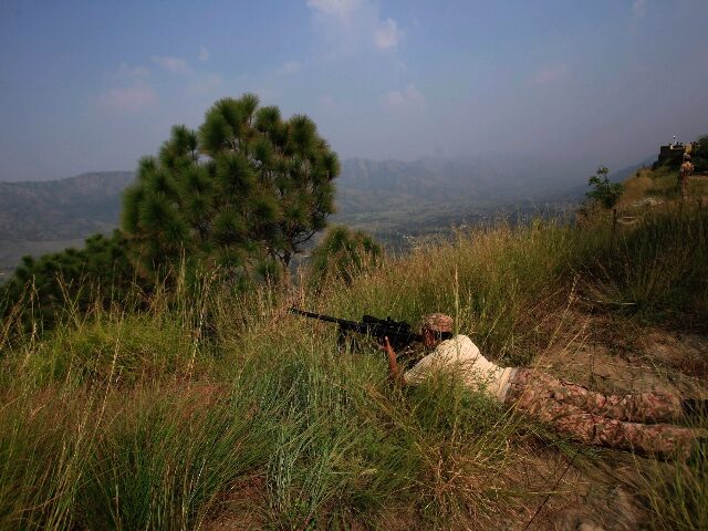 Pakistan army soldiers take positions at a forward area Bagsar post on the Line of Control