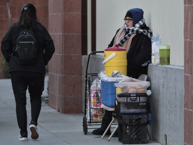 A bundled up breakfast street vendor braves the extreme cold waiting on customers in Los A
