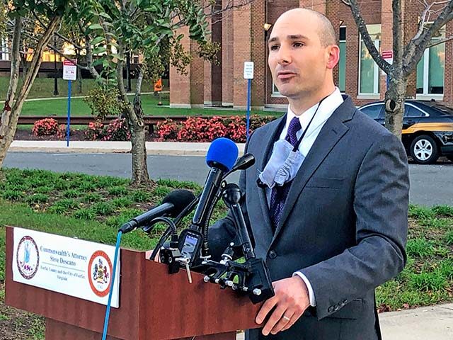 Fairfax County Commonwealth's Attorney Steve Descano speaks during a news conference outsi