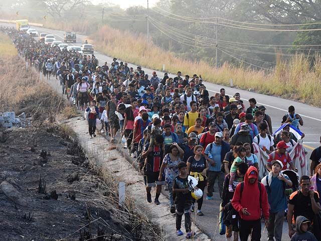 Episcopal - Migrants walk along the highway through Arriaga, Chiapas state in southern Mex