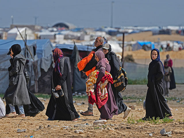 Displaced Palestinians arrive in Khan Younis, Gaza, on Sunday, March 23, 2025. (AP Photo/A
