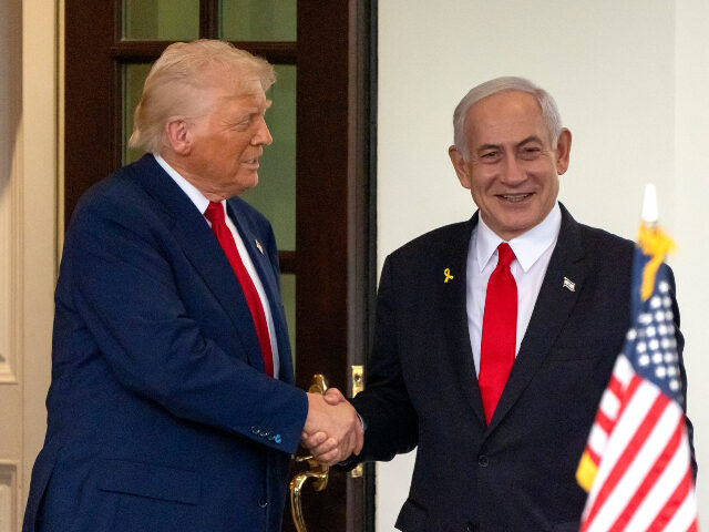 President Donald Trump, left, shakes hands with Israel's Prime Minister Benjamin Neta