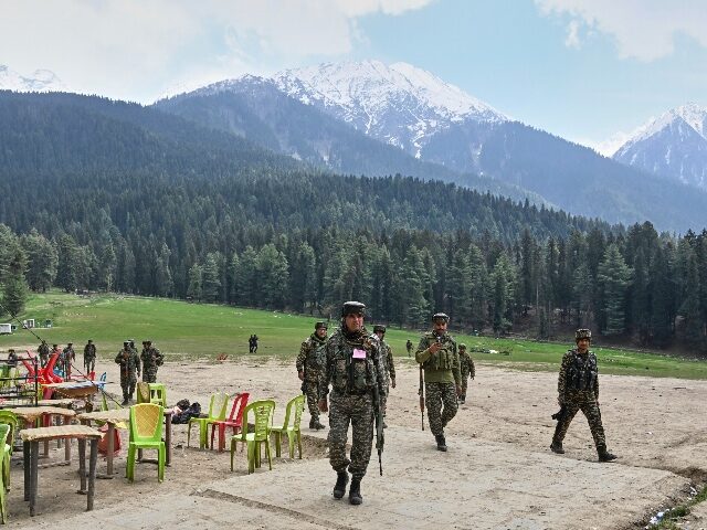 Indian security officers inspect the site in Pahalgam where militants indiscriminately ope