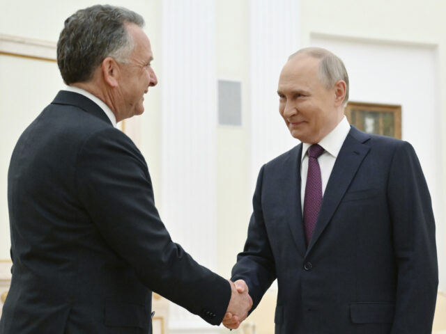 Russia US Russian President Vladimir Putin, right, and U.S. President Donald Trump's special en