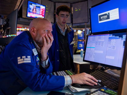 Traders work on the floor of the New York Stock Exchange (NYSE) on April 21, 2025, in New