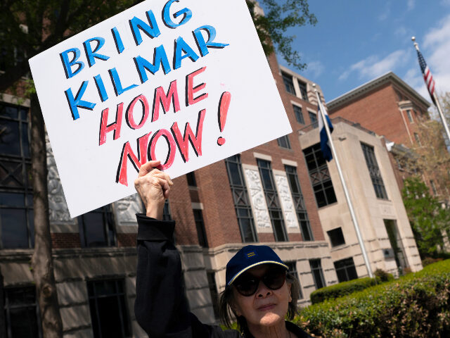 A protestor chants during a demonstration against President Donald Trump's use of El