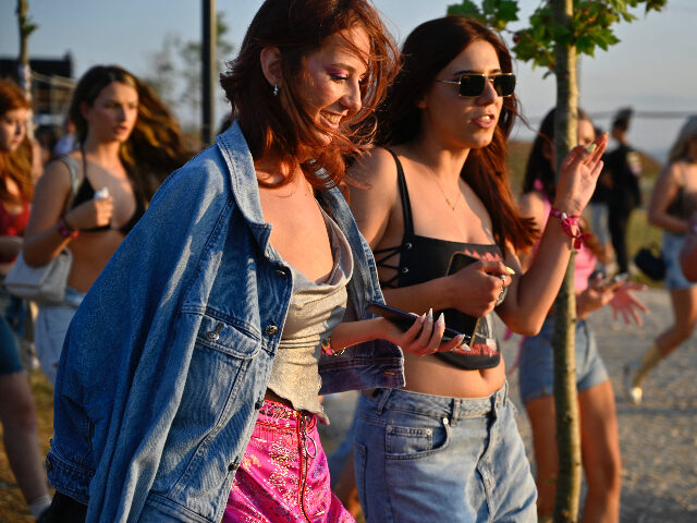 Festivalgoers arrive at the Sunny Hill Festival near Kosovo's capital Pristina on Jul