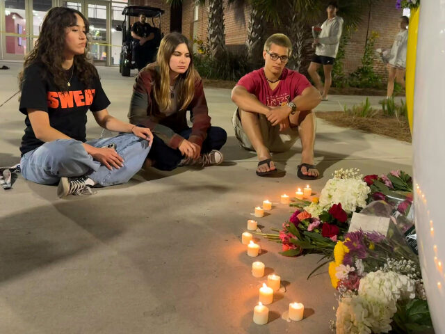 Florida State University shooting People sit in front of a makeshift memorial outside the student union at Florida State Uni