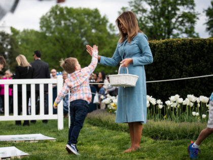 WASHINGTON, DC - APRIL 22 : First Lady Melania Trump greets children at a hopscotch statio