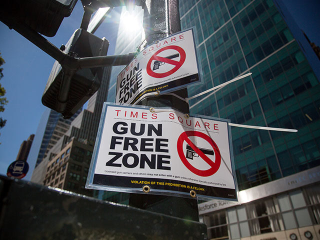 Gun-free zone signages are seen near Times Square in New York, the United States, Sept. 1,