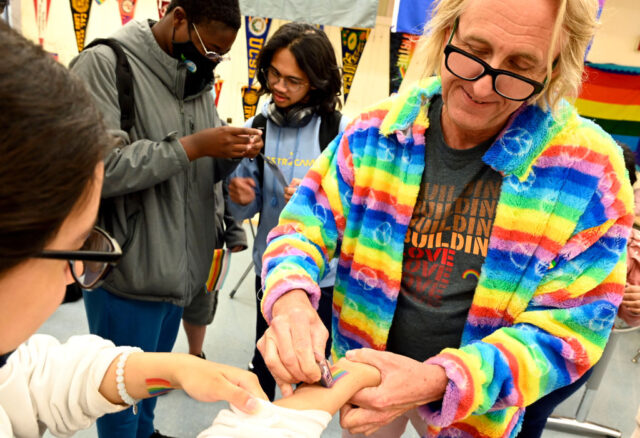 San Pedro , CA - April 22: San Pedro High School teacher David Crowley helps a student wit
