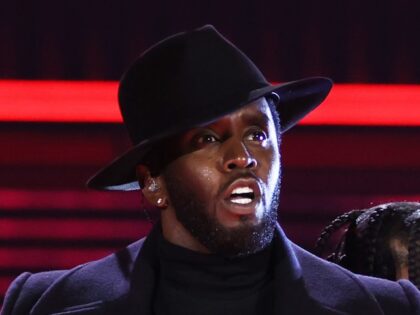 Sean "Diddy" Combs and Jozzy perform on stage during the 2022 Billboard Music Awards held