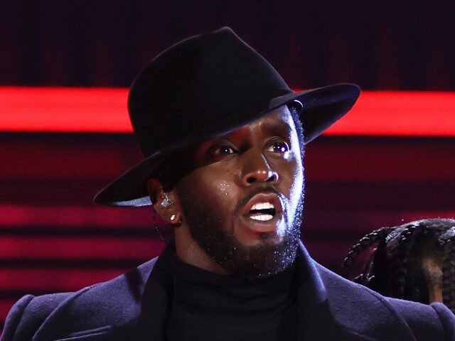 Sean "Diddy" Combs and Jozzy perform on stage during the 2022 Billboard Music Awards held