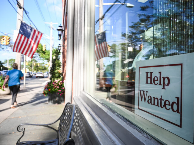 Sayville, N.Y.: A help wanted sign is posted in the storefront window of Kay Cameron Jewel