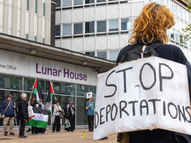 Activists protest against the UK government's recently passed Safety of Rwanda bill and pl