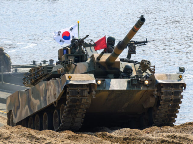 YEONCHEON, SOUTH KOREA - 2025/03/20: South Korean army K1E1 tank crosses a pontoon bridge