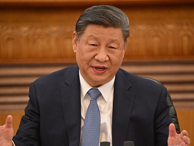 GettyImages-2206612125 China’s President Xi Jinping speaks during a meeting with a group of foreign executives