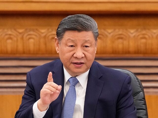 BEIJING, CHINA - MARCH 28: Chinese President Xi Jinping speaks during an international bus