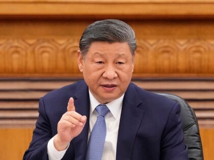 BEIJING, CHINA - MARCH 28: Chinese President Xi Jinping speaks during an international bus