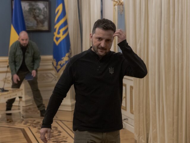 Ukrainian President Volodymyr Zelensky leaves after a press conference in Kyiv on April 4,