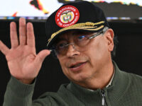 Colombia's President Gustavo Petro waves during an event with Comuneros del Sur, a di