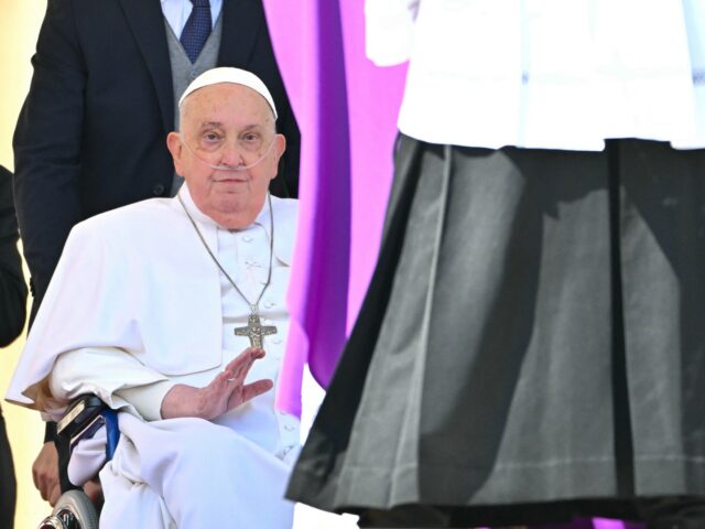 Pope Francis, seen wearing an oxygen breathing apparatus, gestures during a surprise appea