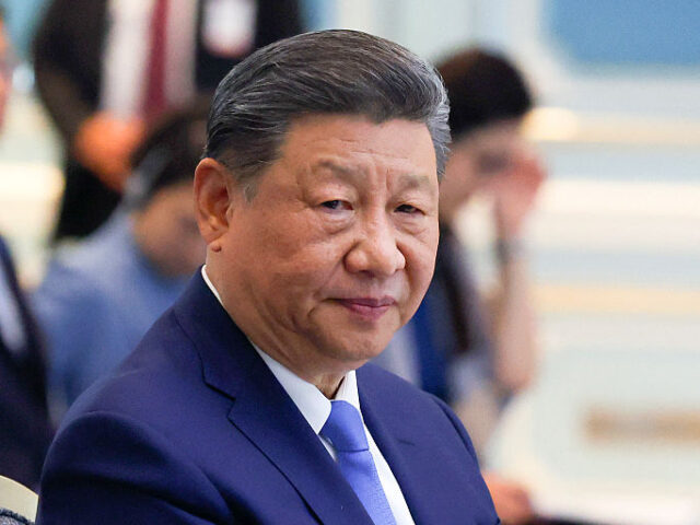 GettyImages-2209950196 China's President Xi Jinping reacts during a bilateral meeting with Malaysia's P