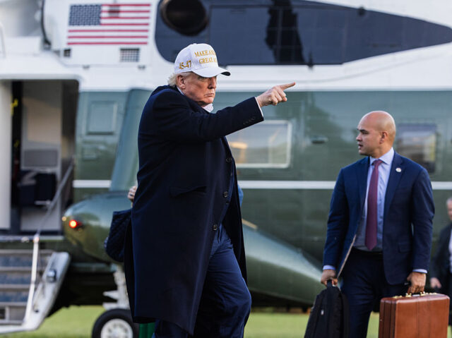 US President Donald Trump, left, and Walt Nauta, White House director of oval office opera