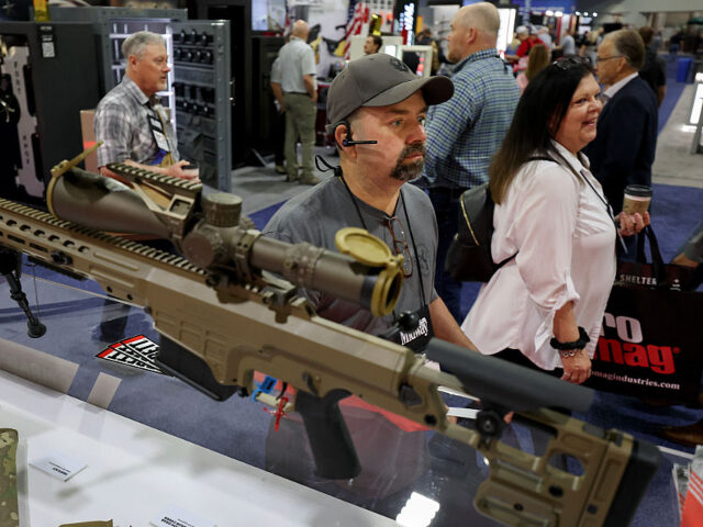GettyImages-2211970540 ATLANTA, GEORGIA - APRIL 25: Mike Halcomb walks past a Barrett Firearms Manufacturing snip