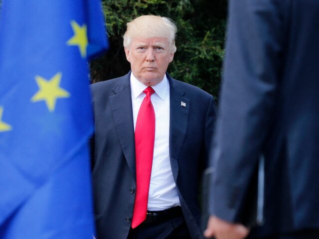 US President Donald Trump arrives to pose for a family photo with participants of the G7 s
