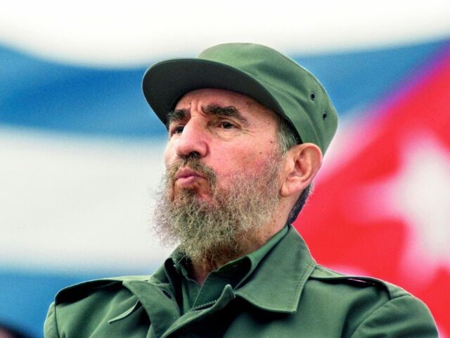 Fidel Castro Ruz, Cubas Head of State and Party, observes the May Day parade at the Revolu