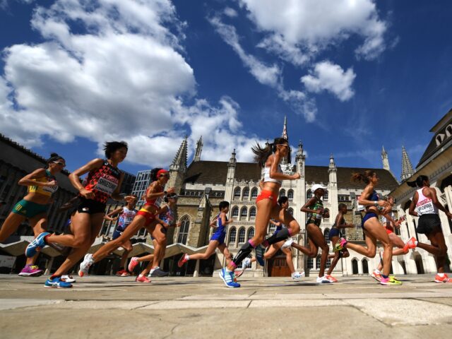 LONDON, ENGLAND - AUGUST 06: Athletes run past Guildhall during the Women's Marathon on da