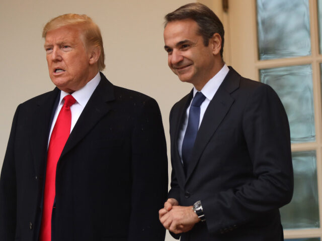 U.S. President Donald Trump poses for photos with Prime Minister of Greece Kyriakos Mitsot