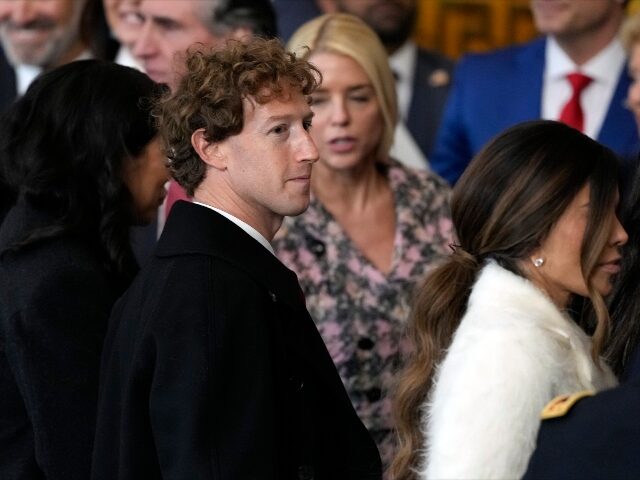 Mark Zuckerberg glancing to the side at Trump inauguration