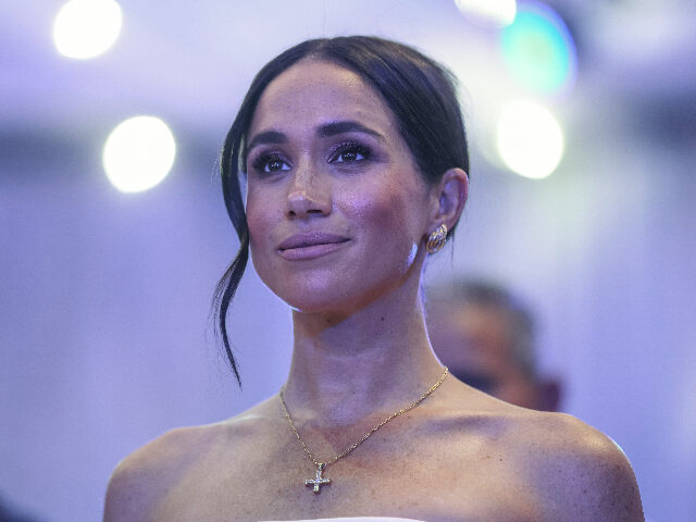 Britain's Meghan, Duchess of Sussex, looks on as she attends a Sit Out with Britain&#