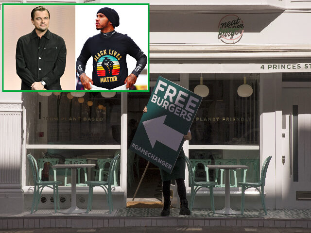NeatBurger A employee carries a sign offering free burgers during the launch of the meat-free Neat Bu
