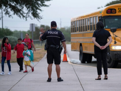 Southside Independent School District police officer Ruben Cardenas, center, keeps watch a