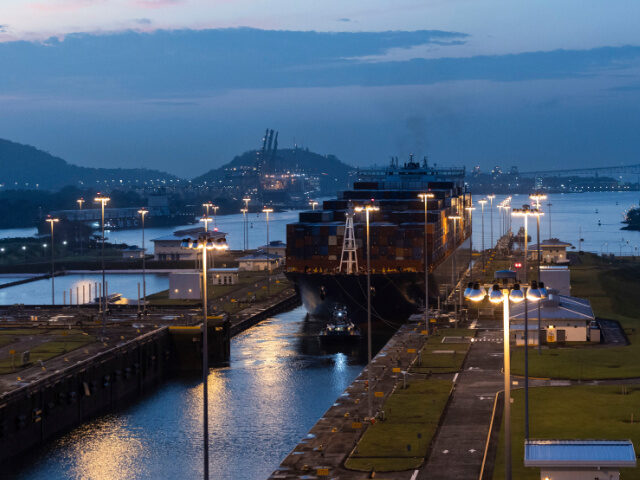A tug guides a container ship through the Cocoli Locks at the Panama Canal in Panama City,