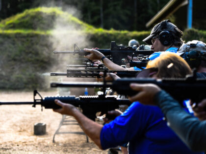 Students fire AR-15 semi-automatic rifles during a shooting course at Boondocks Firearms A