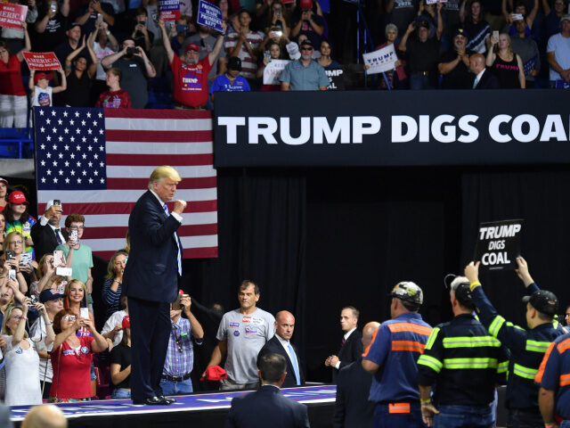 US President Donald Trump salutes his supporters at a political rally at Charleston Civic