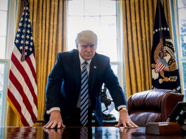 Trump Poses at Resolute Desk In this Friday, April 21, 2017, file photo, President Donald Trump poses for a portrait in