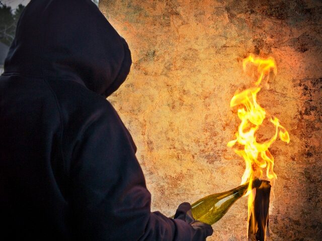 Trump hating thug holding molotov cocktail
