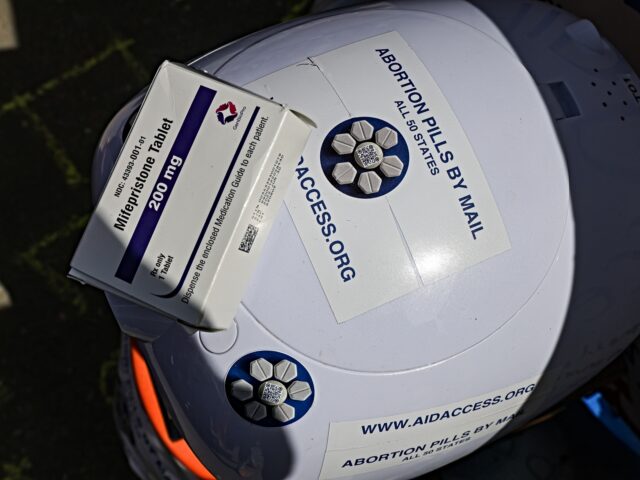 A box of mifepristone pills on a robot outside the US Supreme Court in Washington, DC, US,