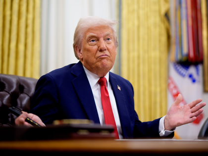 President Donald Trump gestures while speaking during an executive order signing event in
