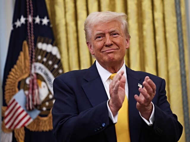 WASHINGTON, DC - FEBRUARY 21: U.S. President Donald Trump applauds after Howard Lutnick wa